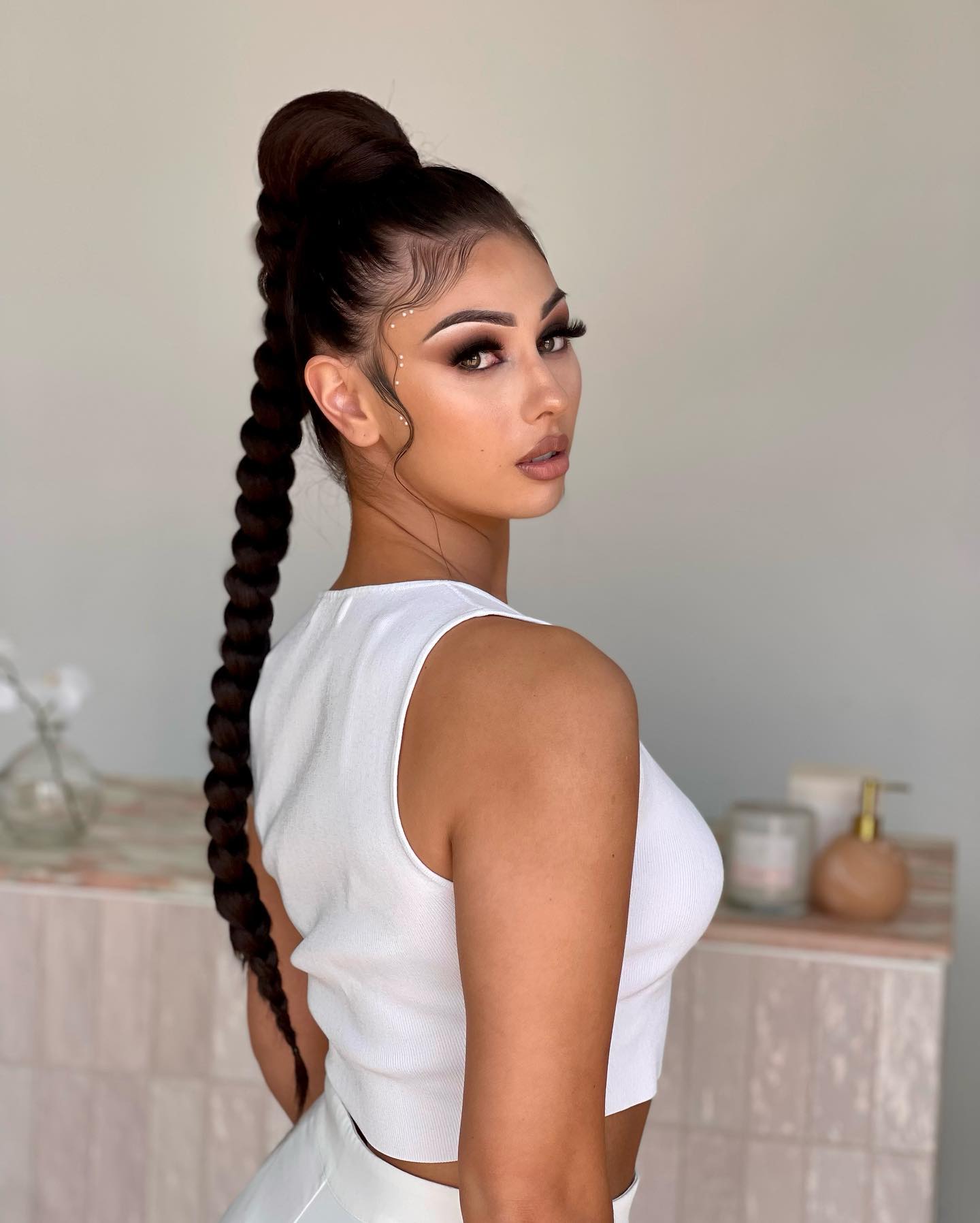 top bun with tail hairstyle for adult girls